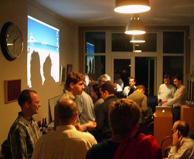 Bruno Georges (top-right) gets ready to give his presentation while everyone socialises